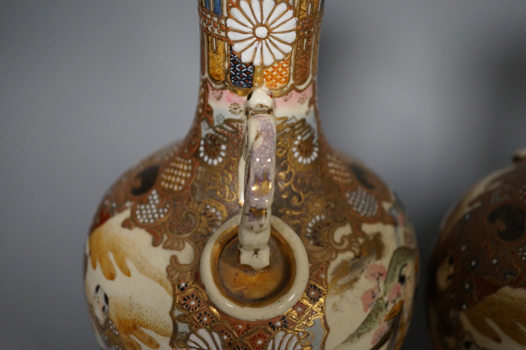 A pair of Japanese satsuma pottery vases, 30.5 cm high